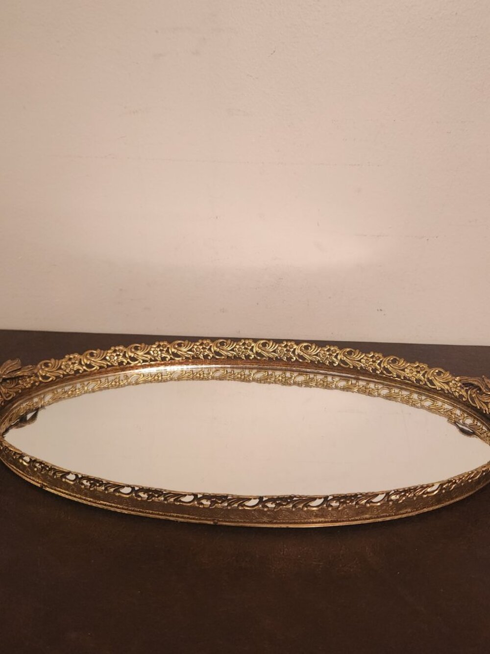 Rare and ornate Victorian French gold oval vanity mirror.